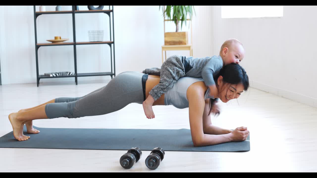 Mother and Baby Doing Plank Exercise at Home