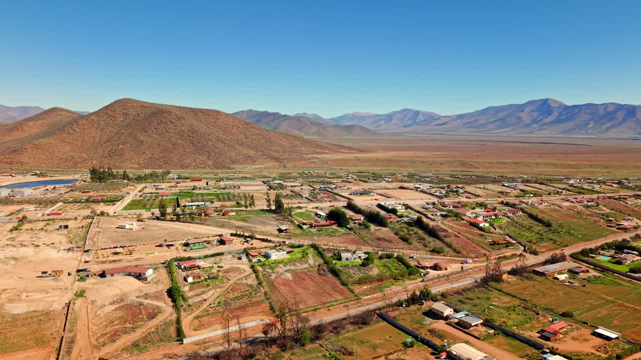 Aerial view establishing small parcels in Vallenar in the Huasco Valley on a sunny day in the Atacama Region