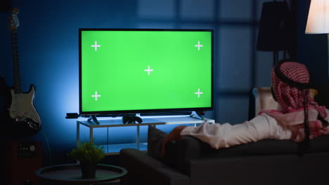 Man-watching-news-on-mockup-TV