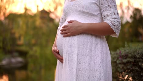 pregnant woman feeling happy at garden home.