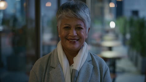 portrait happy mature business woman laughing enjoying successful lifestyle professional female executive in urban evening slow motion
