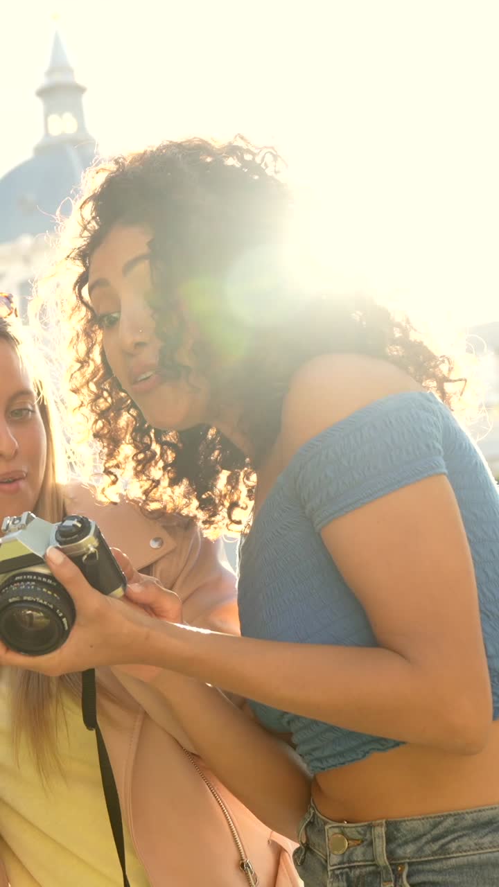 Friends taking photos with a vintage camera