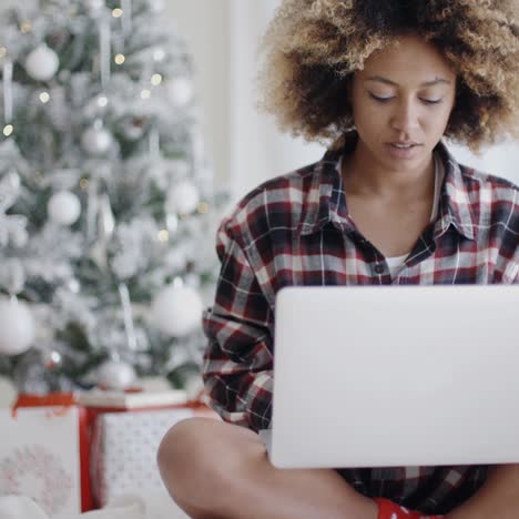 young student working on her laptop