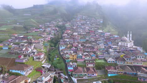 sideways aerial of nepal van java, mountains shrouded in fog