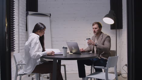 man and woman having a business meeting in boardroom 2