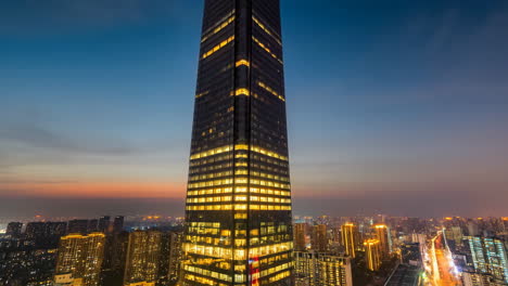 modern skyscraper at dusk overlooking a city