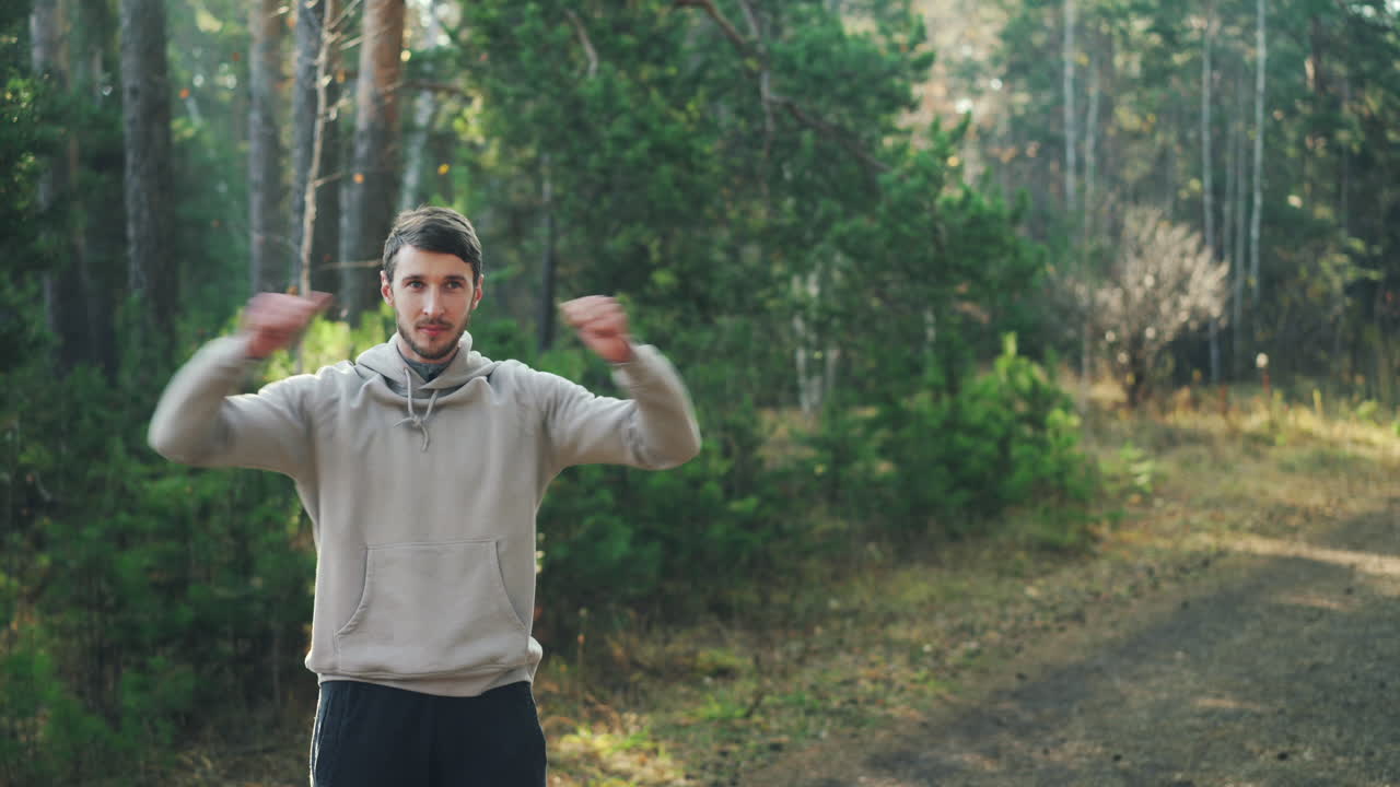 Man Stretching in a Forest