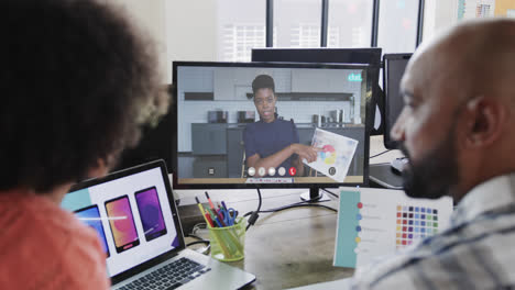 African-american-business-people-on-video-call-with-african-american-female-colleague-on-screen