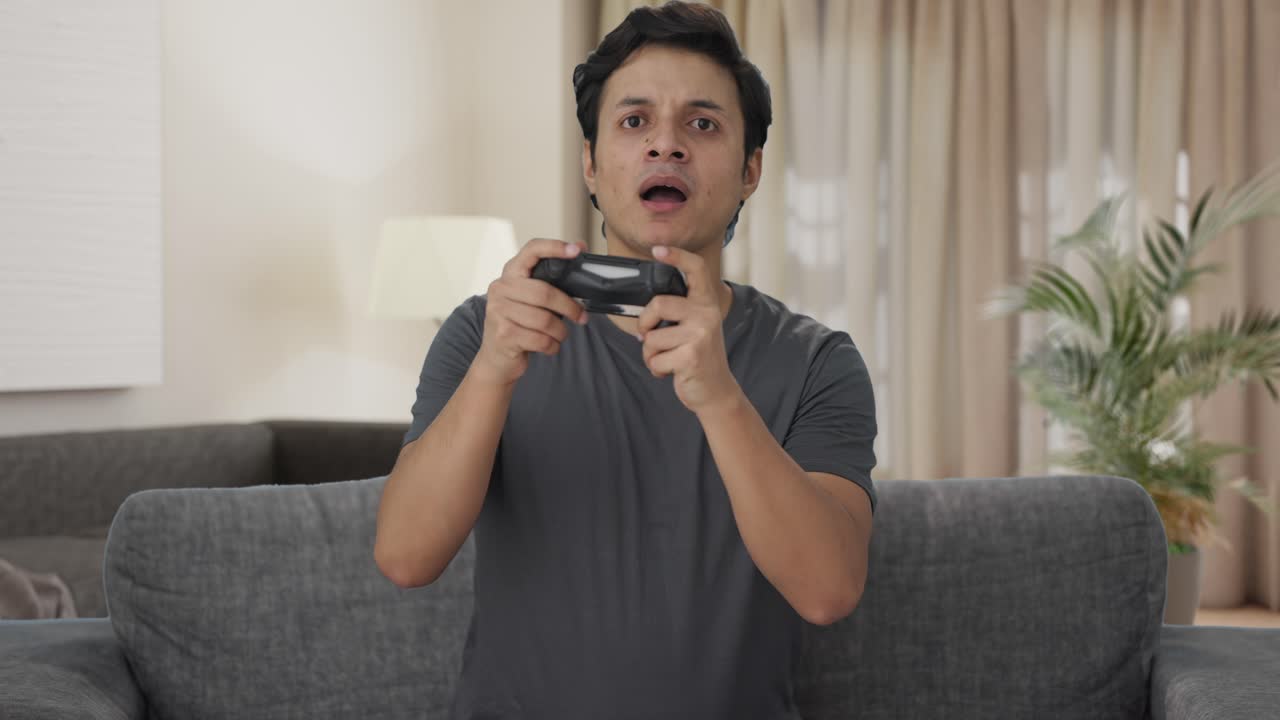 Frustrated Indian man loses a match in video game