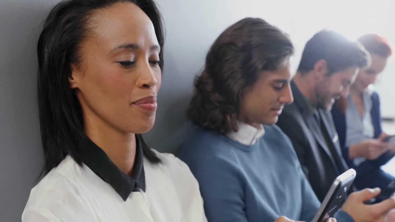 Group of executives using mobile phone 4k