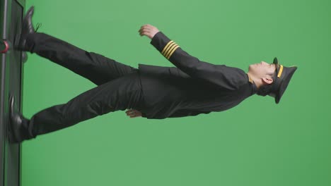 pilot in black uniform walking on green screen