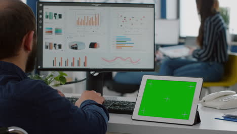 Paralyzed-manager-analysing-statistics-looking-at-tablet-with-izolated-display