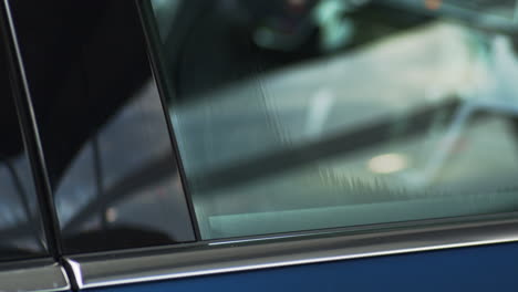 close-up of a car window opening and closing