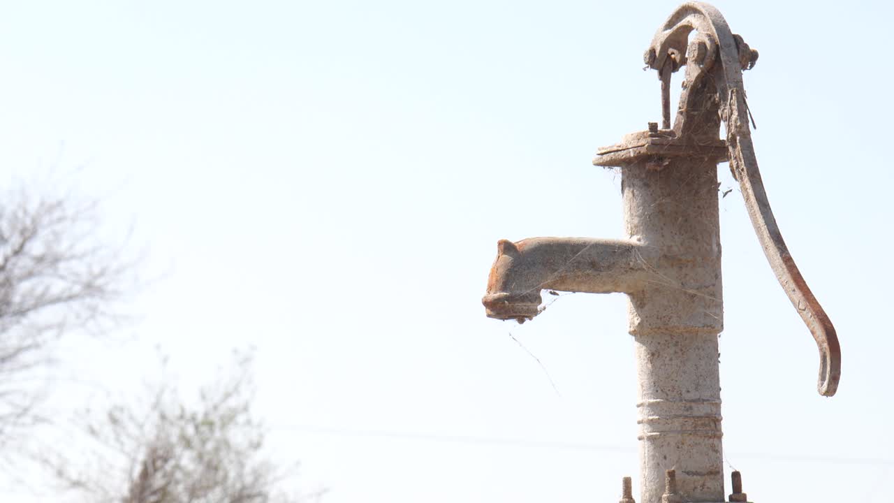 Rusty Water Pump With Cobwebs In Rural Sindh
