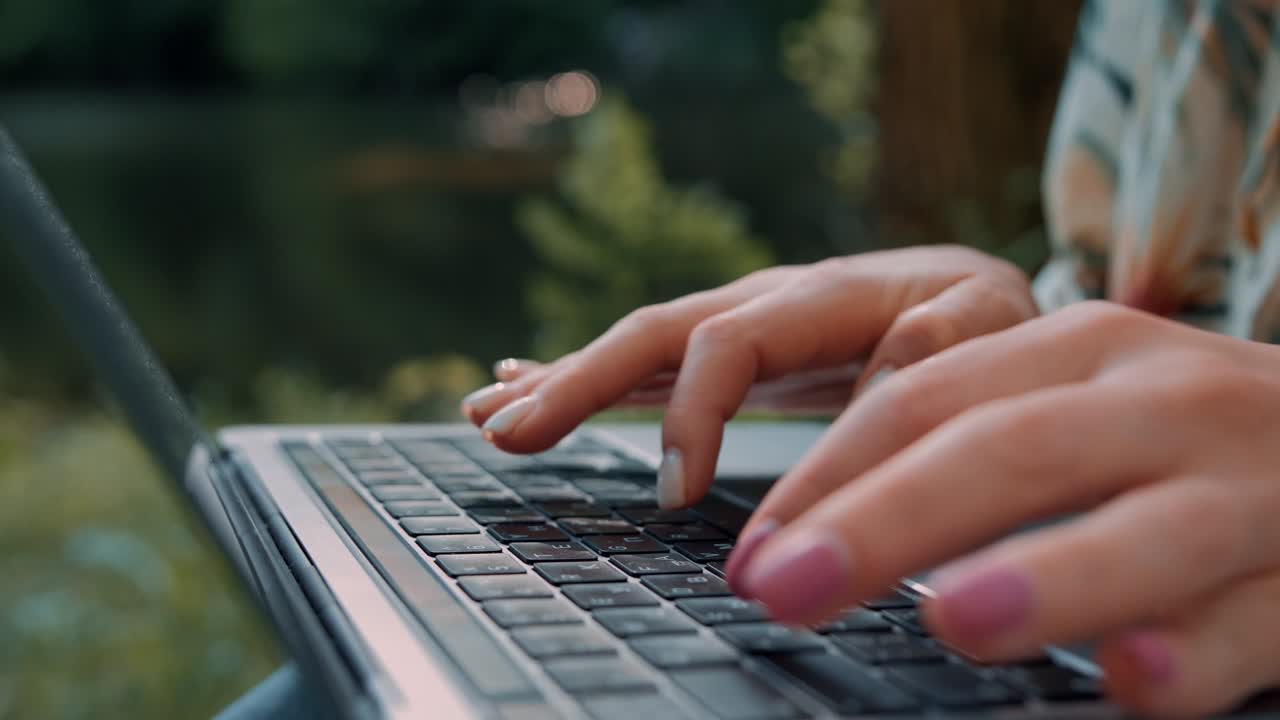 Girl fingers on a laptop keyboard