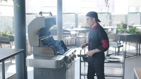 chef grilling burgers on outdoor grill