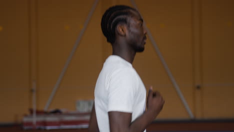 young man running indoors