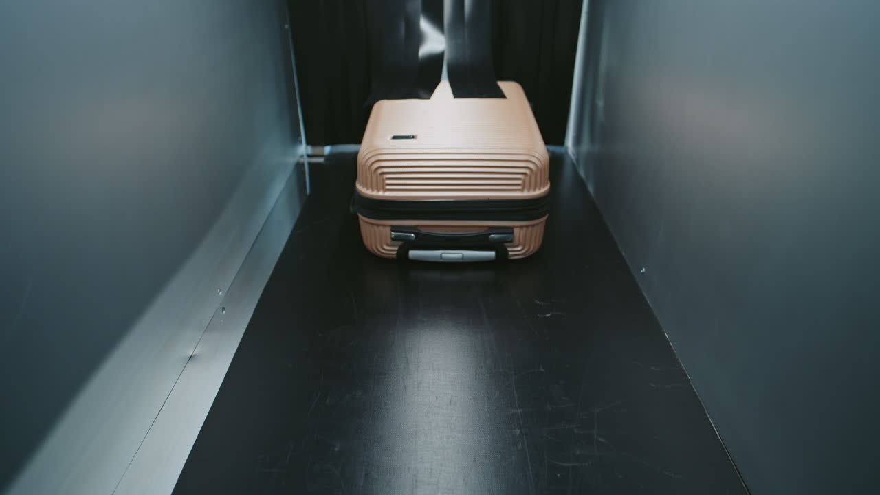 Luggage being scanned at an airport security checkpoint