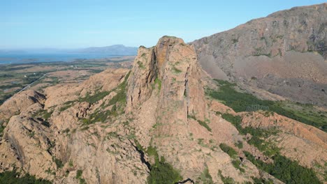 a panorama of the orange cliffs and rock mountains under the blue sky