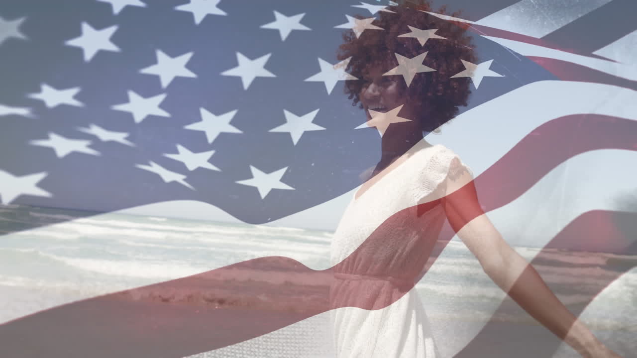 una joven biracial bailando con nosotros agitando una bandera en primer plano.