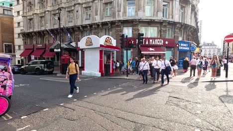 pedestrians and cyclists navigate a bustling intersection