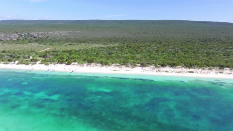 Vast-tropical-island-panorama-with-long-sand-beach-and-turquoise-water,-aerial