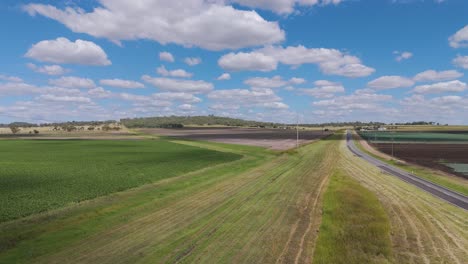 drone captures expansive fields and winding road