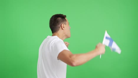 rear view of a man waving a finnish pennant