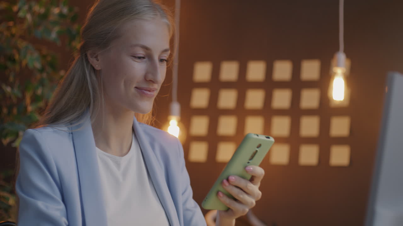 Woman using smartphone and credit card