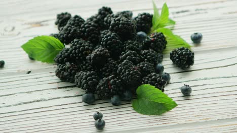 heap of blackberry with mint leaves