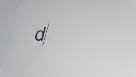 a close up of a digital screen showing a text cursor and the word "decline" being typed