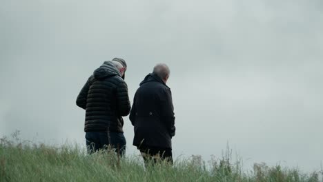retirement leisure exercise, coastal walking, elderly couple together