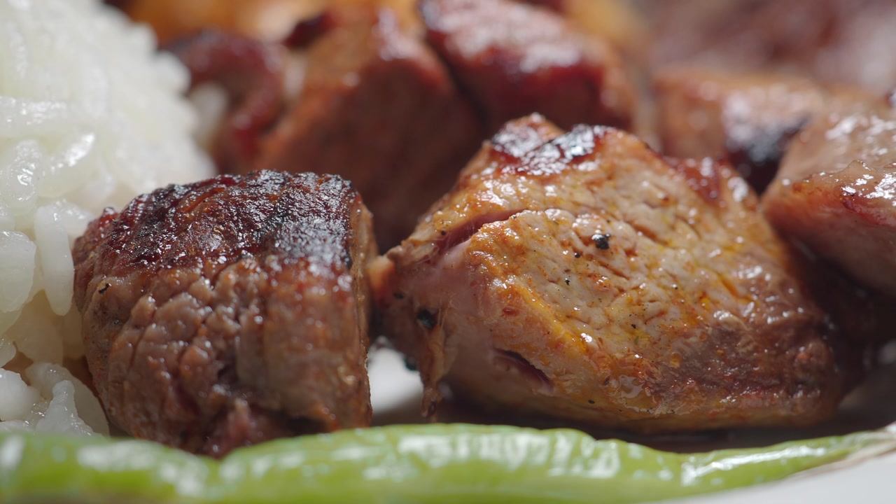 Close-up of Delicious Grilled Meat with Rice and Pepper