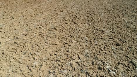 drone flying up to the stone ground, that is an empty space.