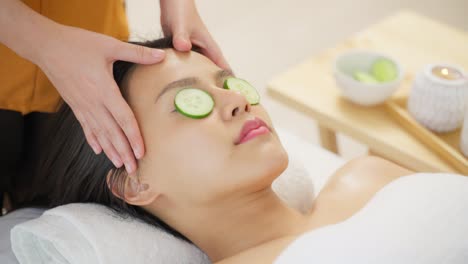 cucumber facial treatment at a spa