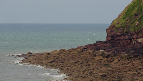 wide shot of exposed rocks at low tide at Saint bees headland. West lake district