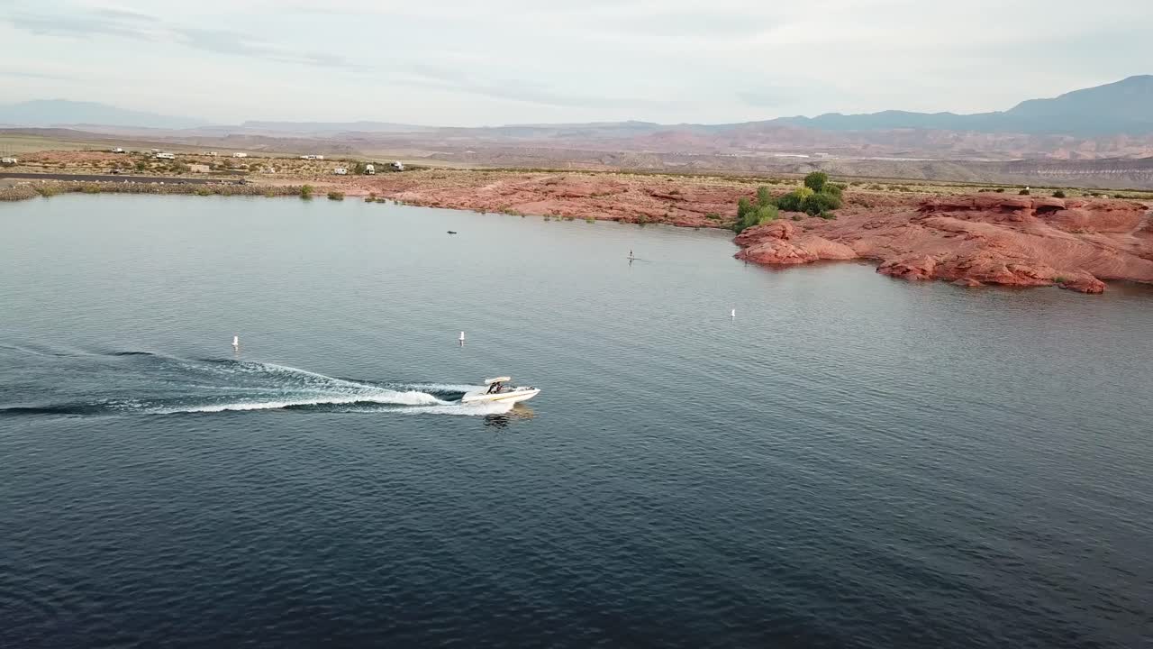 Drone Aerial View of Boat Sailing in Water Reservoir of Sand Hollow State Park and Recreational Area, Utah USA