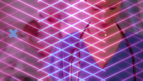 female healthcare pro in scrubs monitoring data in clinic, showing neon grid and x graphics