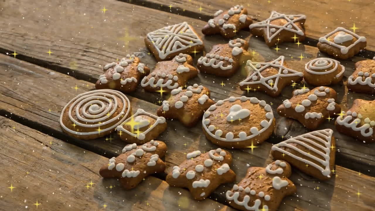 Animation of snow falling over christmas cookies on wooden background