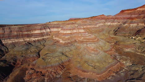 aerial view of mountain peaks in a canyon, bird's eye view, down shot, motion