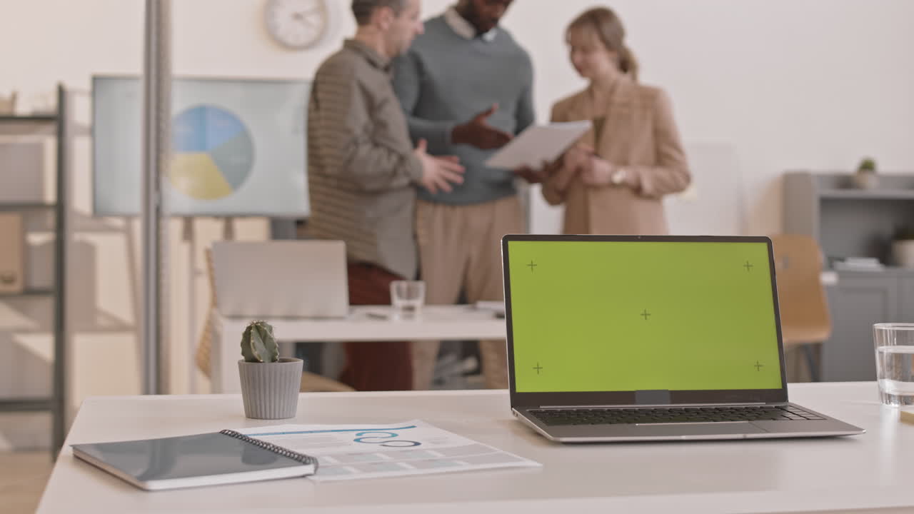 Laptop with Chromakey in Busy Office