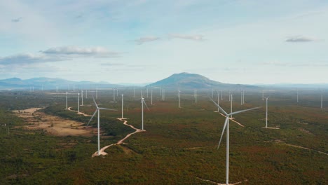 Beautiful-colorful-drone-shot-of-a-wind-turbine-park-at-dusk