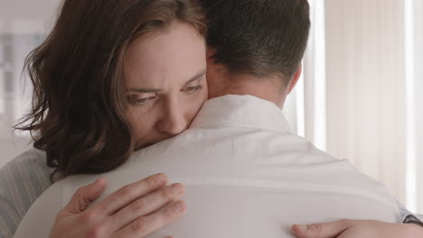 unhappy woman hugging boyfriend young couple having relationship trouble embracing emotional issues sharing bad news