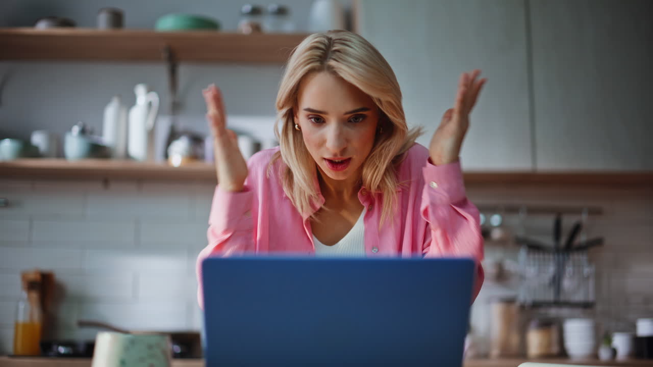 Stressed accountant checking papers having laptop videocall at workspace closeup