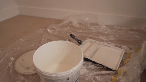 empty room with wall white painting equipment on the floor in house in cambridge england