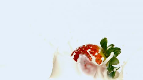 strawberry falling on milk against white background 4k