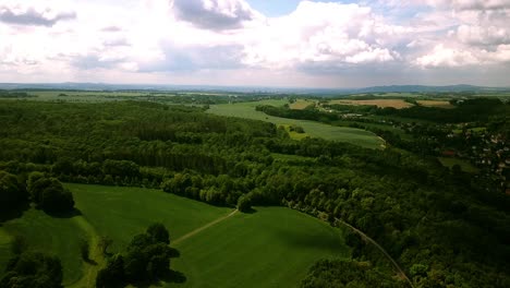 high altitude footage of beautiful saxony countryside with graded skies and clouds while camera moves slowly forward