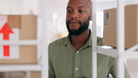 black man, warehouse and box