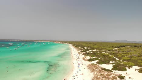 Spain,-Mallorca-Platja-des-Trenc-beach-a-beautiful-fly-by-over-the-beach-at-4k-24-fps-with-ND-filters-on-a-very-bright-day-with-a-DJI-Mavic-Air-drone