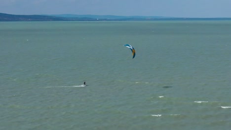 kite wind surfing on the lake balaton in hungary recorded with a dji mavic 2 pro